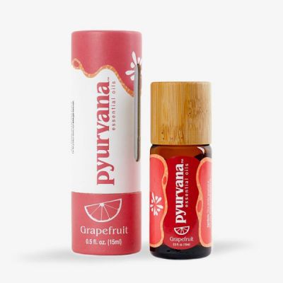 a bottle of 15ml grapefruit essential oil made by Pyurvana next to a cardboard tube