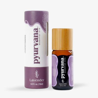 a bottle of glass with bamboo cap containing lavender oil next to a Pyurvana packaging tube