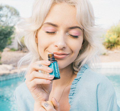 Model holding thyme essential oil